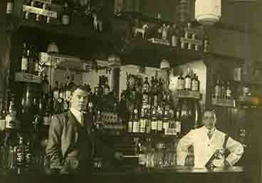 One of the owners James Omand on the left with head barman on the right 1938
